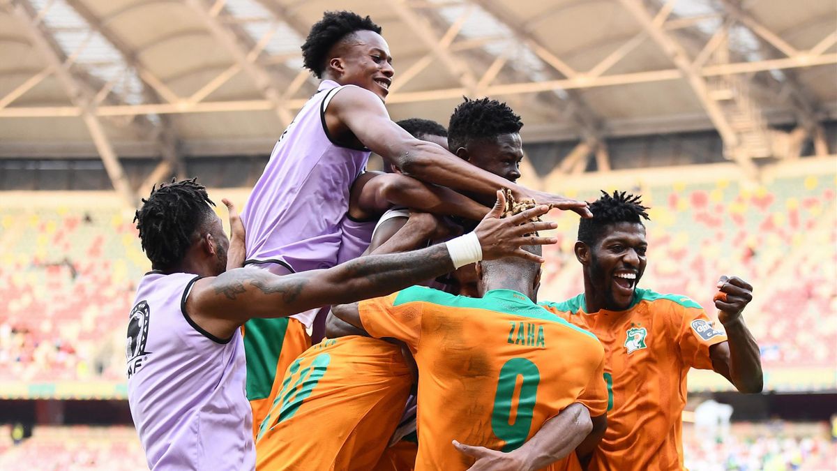 Ivory Coast players celebrate after Ivory Coast's forward Sebastien Haller scored his team's first goal during the Group E Africa Cup of Nations (CAN) 2021 football match between Ivory Coast and Sierra Leone at Stade de Japoma in Douala on January 16, 202