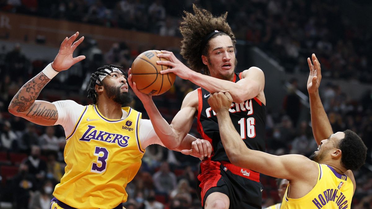 CJ Elleby #16 of the Portland Trail Blazers gathers a rebound against Anthony Davis #3 and Talen Horton-Tucker #5 of the Los Angeles Lakers during the first quarter at Moda Center on February 09, 2022 in Portland, Oregon