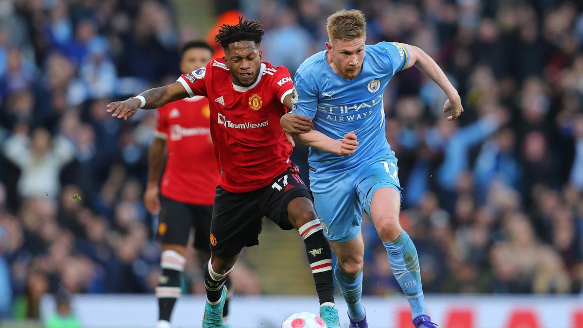 Kevin De Bruyne of Manchester City beats Fred of Manchester United during the Premier League match between Manchester City and Manchester United at Etihad Stadium on March 06, 2022 in Manchester, England