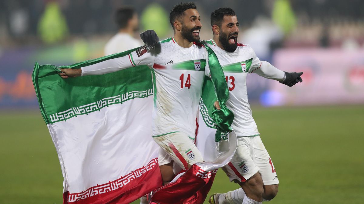 Hossein Kanani and Samam Ghodoos celebrate after the match during FIFA World Cup Qualifier match between Iran v Iraq