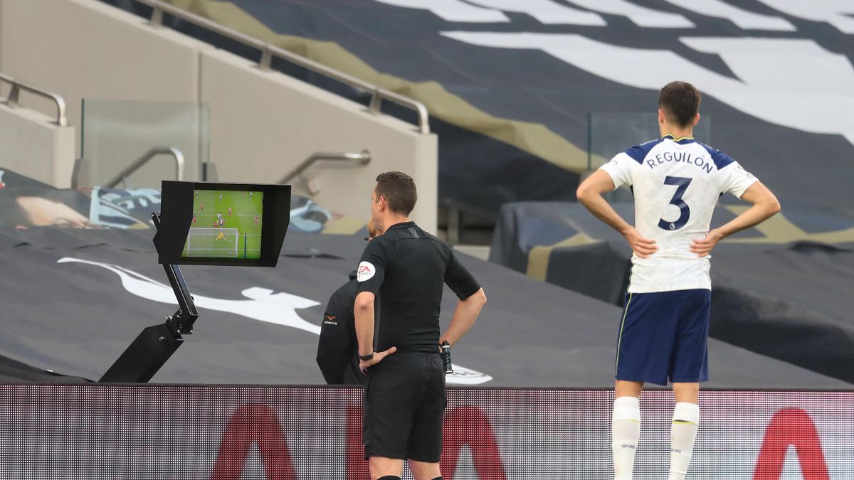 Referee David Coote reviews the VAR screen before disallowing a goal scored by Son Heung-Min of Tottenham Hotspur (not pictured) for offside during the Premier League match between Tottenham Hotspur and Southampton at Tottenham Hotspur Stadium on April 21