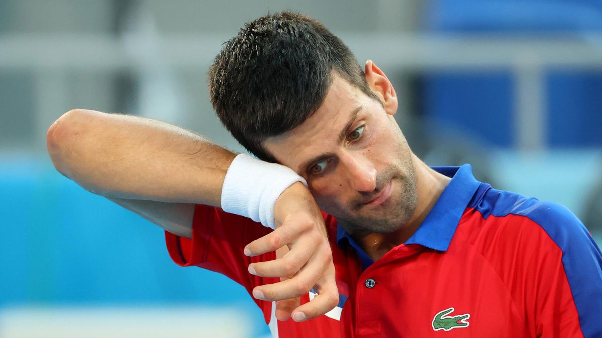 Novak Djokovic of Team Serbia reacts against Pablo Carreno Busta of Team Spain during the Men's Singles Bronze Medal Match on day eight of the Tokyo 2020 Olympic Games at Ariake Tennis Park