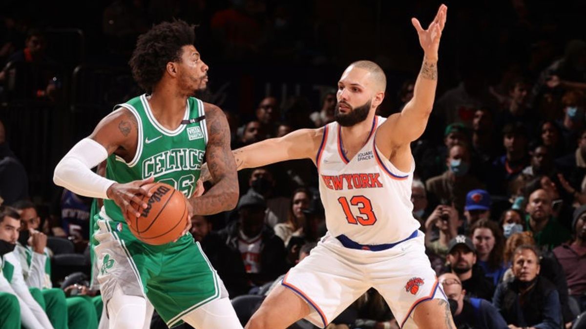 Evan Fournier #13 of the New York Knicks plays defense on Marcus Smart #36 of the Boston Celtics during the game on January 6, 2022 at Madison Square Garden in New York City