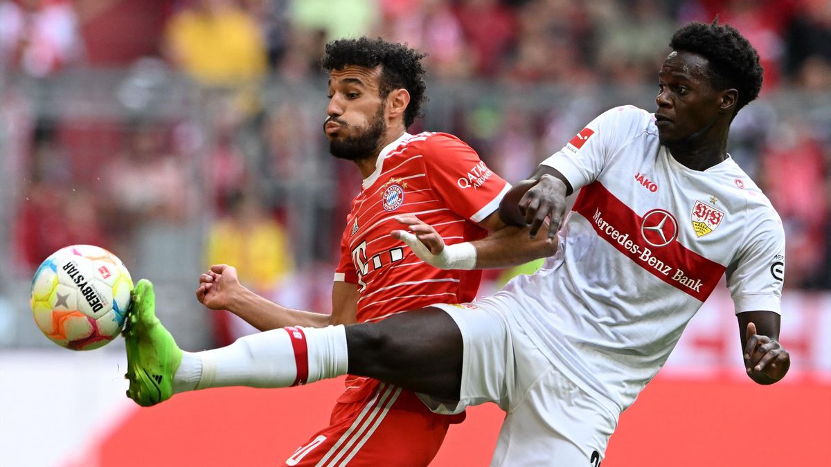 Bayern Munich's Moroccan defender Noussair Mazraoui (L) and Stuttgart's French midfielder Naouirou Ahamada (R) vie for the ball during the German first division Bundesliga football match between FC Bayern Munich and VfB Stuttgart in Munich, southern Germa
