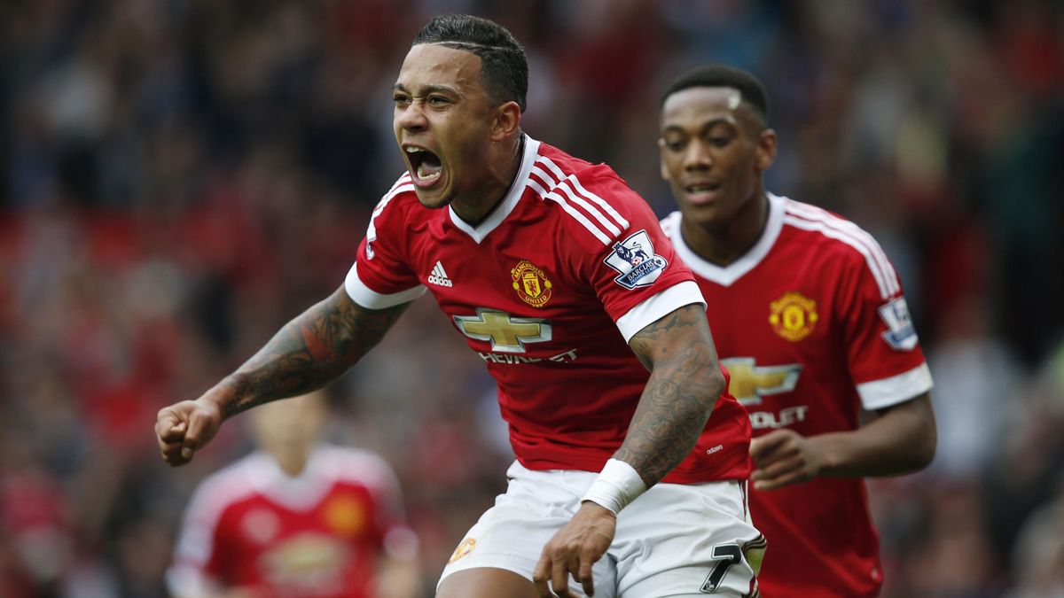 Manchester United's Memphis Depay celebrates after scoring their first goal