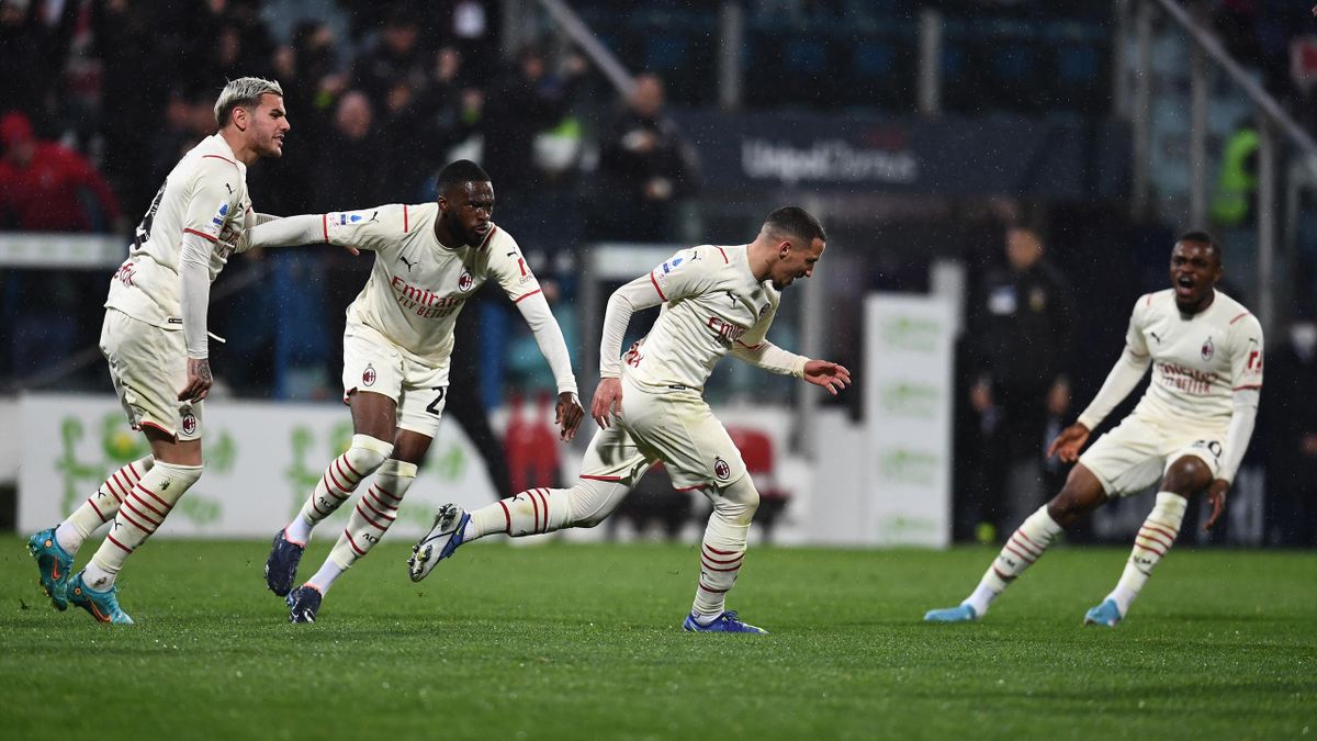 Ismael Bennacer of AC Milan celebrates with team-mates after scoring the opening goal during the Serie A match between Cagliari Calcio and AC Milan at Sardegna Arena