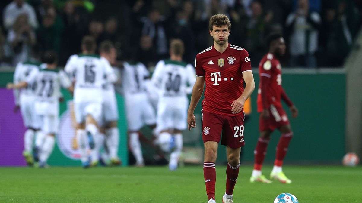 Thomas Mueller of FC Bayern Muenchen reacts after Ramy Bensebaini of Borussia Moenchengladbach (not pictured) scored their teams third goal during the DFB Cup second round match between Borussia Mönchengladbach and Bayern München at Borussia Park Stadium
