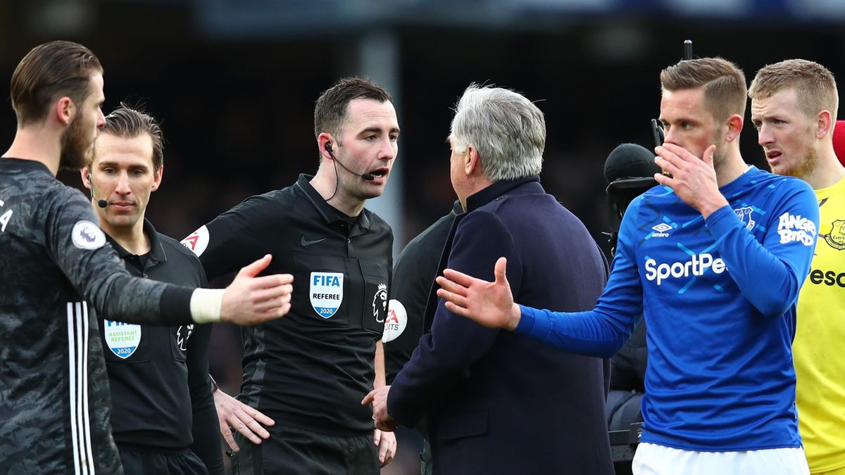 Carlo Ancelotti, Manager of Everton confronts Referee Chris Kavanagh during the Premier League match between Everton FC and Manchester United at Goodison Park on March 01, 2020 in Liverpool, United Kingdom.