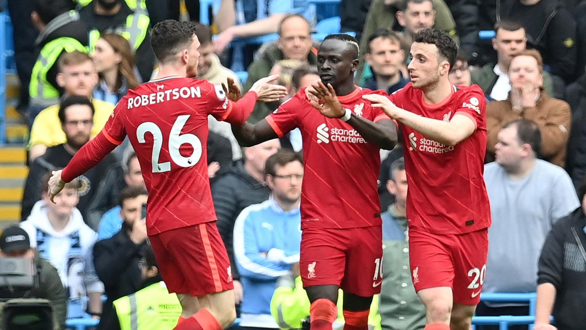 Liverpool's Senegalese striker Sadio Mane (C) celebrates scoring the team's second goal during the English Premier League football match between Manchester City and Liverpool at the Etihad Stadium in Manchester, north west England, on April 10, 2022