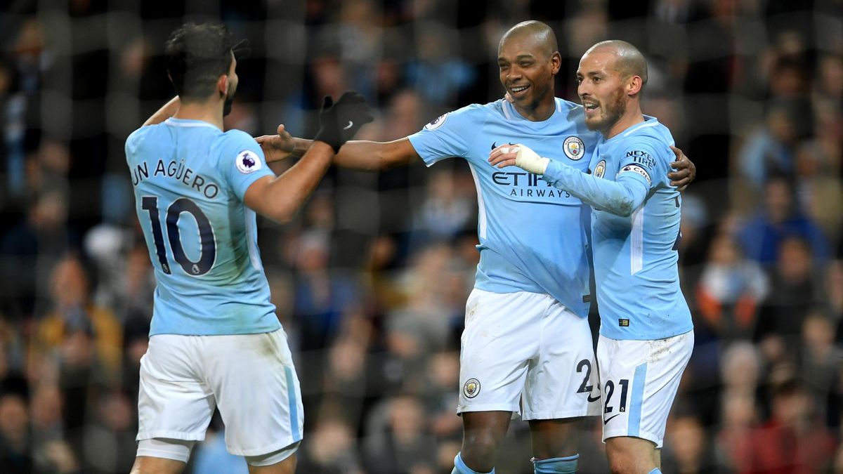 Fernandinho of Manchester City celebrates after scoring his sides first goal with Sergio Aguero of Manchester City and David Silva of Manchester City during the Premier League match between Manchester City and West Bromwich Albion at Etihad Stadium on Ja