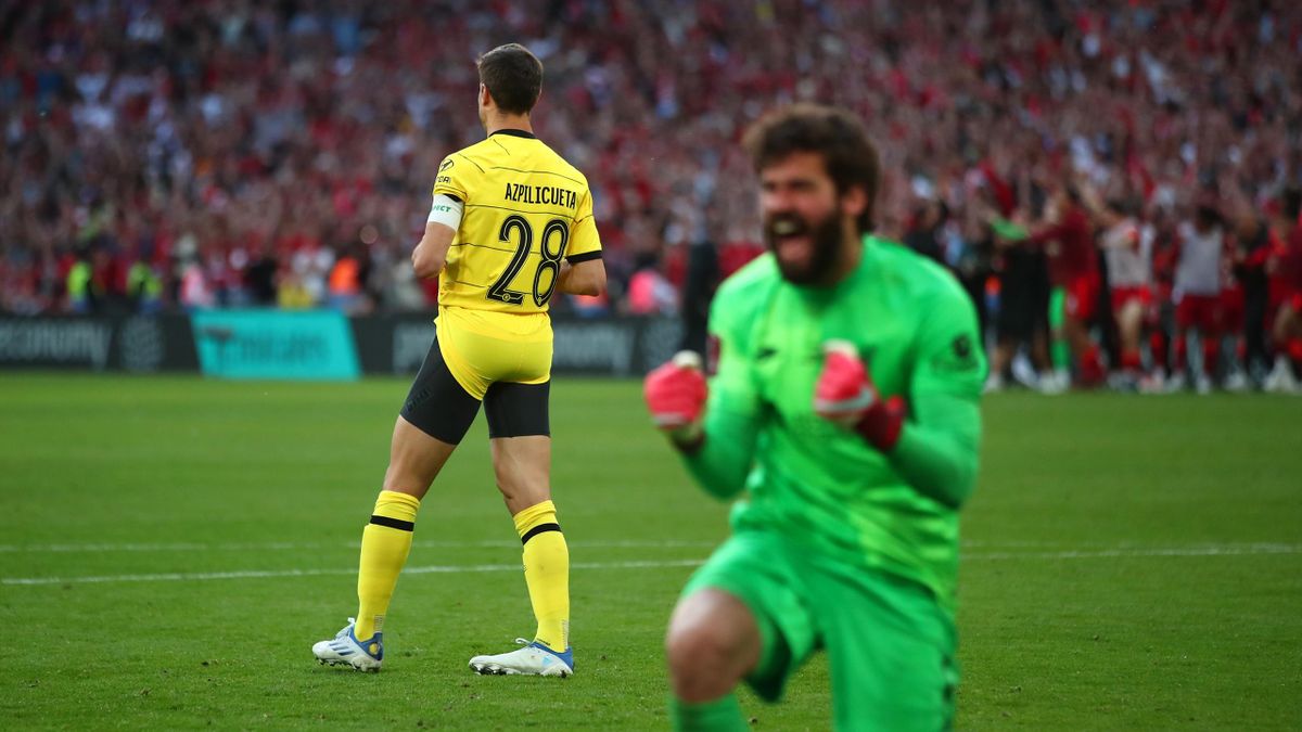 Cesar Azpilicueta of Chelsea looks dejected after missing a penalty, as Alisson of Liverpool celebrates during The FA Cup Final match between Chelsea and Liverpool at Wembley Stadium on May 14, 2022 in London, England.