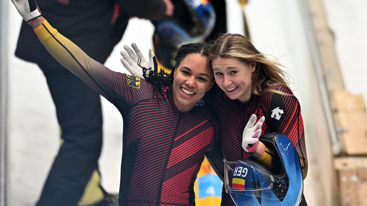 Germany's Laura Nolte (R) and Deborah Levi celebrate after winning the gold medal in the final run in the 2-woman bobsleigh event at the Yanqing National Sliding Centre during the Beijing 2022 Winter Olympic Games