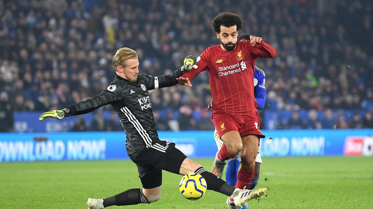 Mohamed Salah of Liverpool knocks the ball past Kasper Schmeichel of Leicester City during the Premier League match between Leicester City and Liverpool FC at The King Power Stadium on December 26, 2019 in Leicester, United Kingdom.