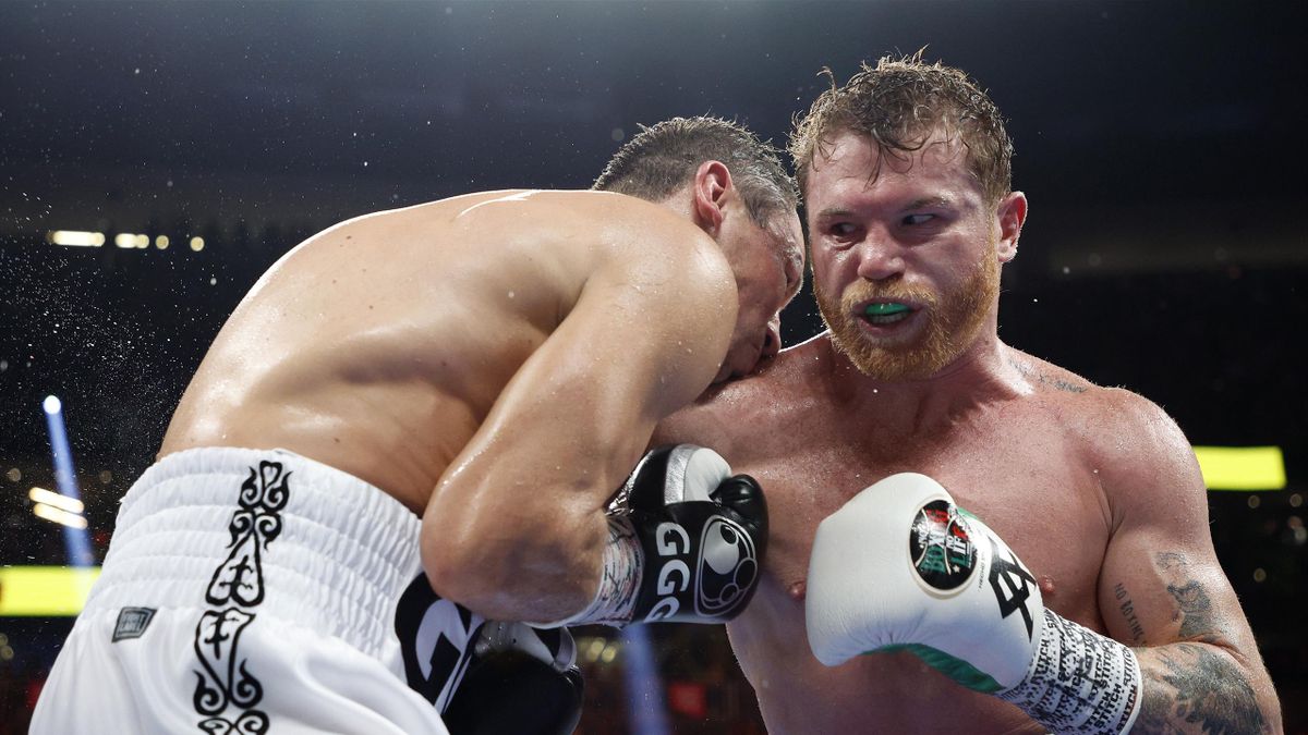 Canelo Alvarez (red trunks) lands a punch against Gennady Golovkin (white trunks) in round 12 of the fight for the super middleweight title at T-Mobile Arena