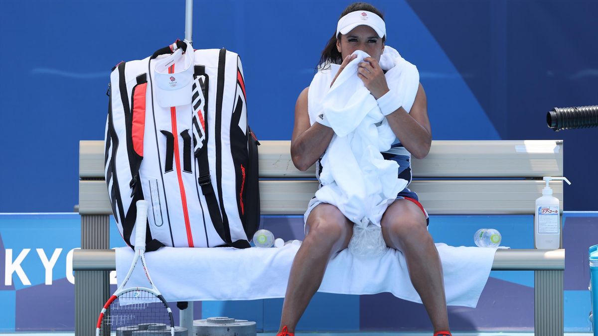 Heather Watson of Team Great Britain wipes her face during her Women's Singles First Round match against Anna-Lena Friedsam