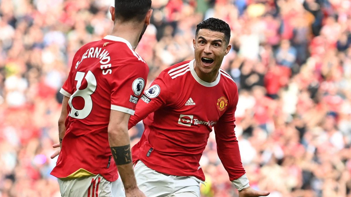 Manchester United's Portuguese striker Cristiano Ronaldo celebrates after scoring his third goal during the English Premier League football match between Manchester United and Norwich City.
