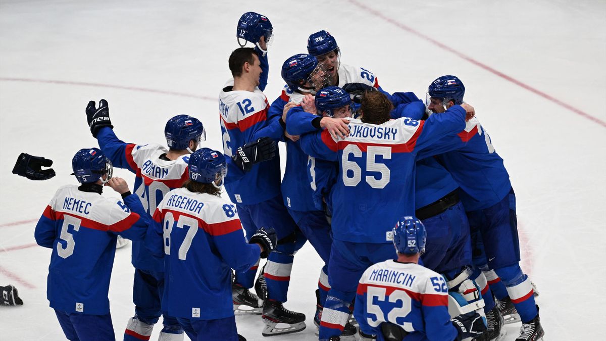 Players of Slovakia celebrate after defeating Sweden 4-0 in the men's bronze medal match of the Beijing 2022 Winter Olympic Games ice hockey competition, at the National Indoor Stadium in Beijing on February 19, 2022