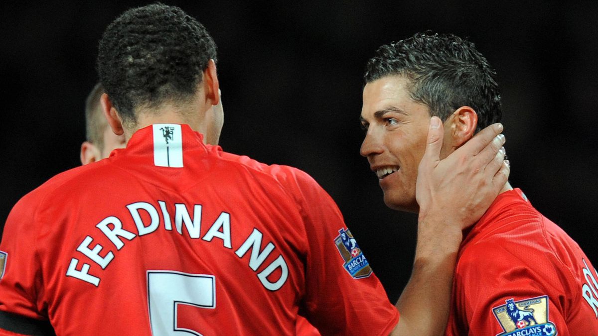 Cristiano Ronaldo (R) celebrates with teammate Rio Ferdinand