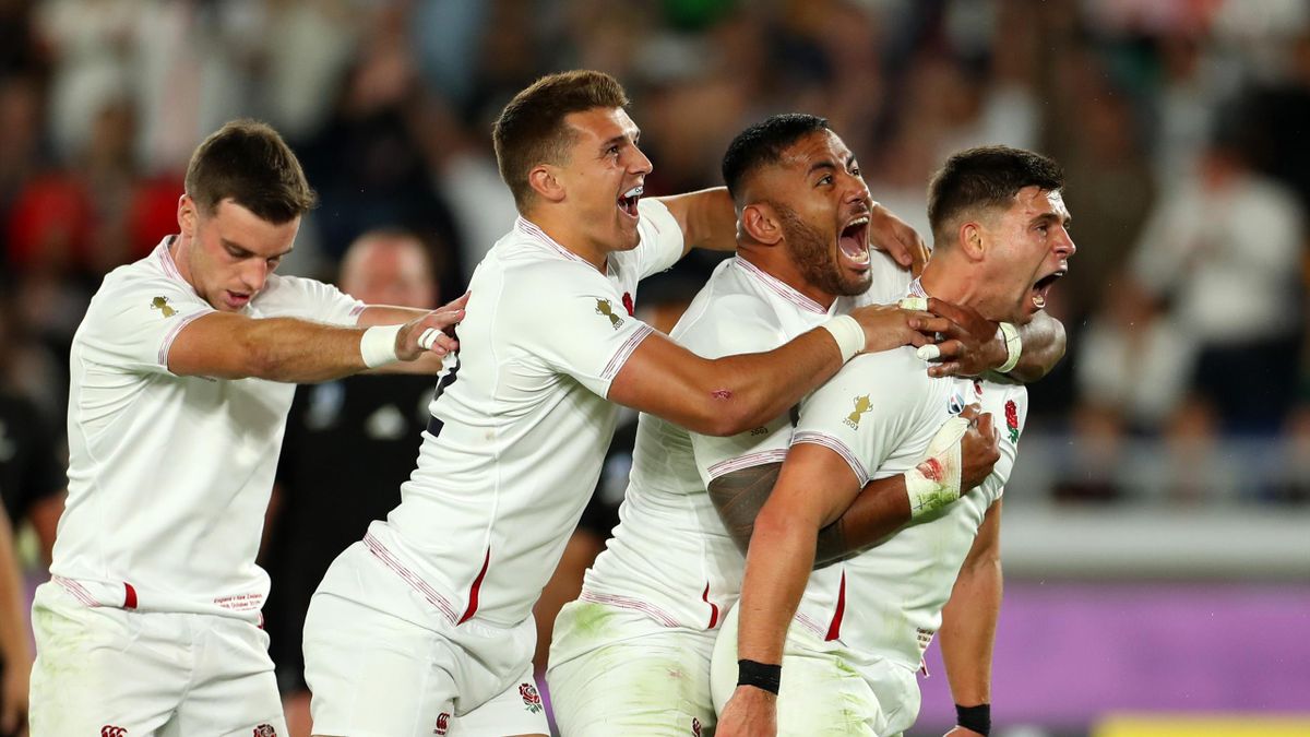 Ben Youngs of England celebrates with Henry Slade and Manu Tuilagi of England after scoring a try prior to being disallowed during the Rugby World Cup 2019 Semi-Final match between England and New Zealand at International Stadium Yokohama on October 26, 2