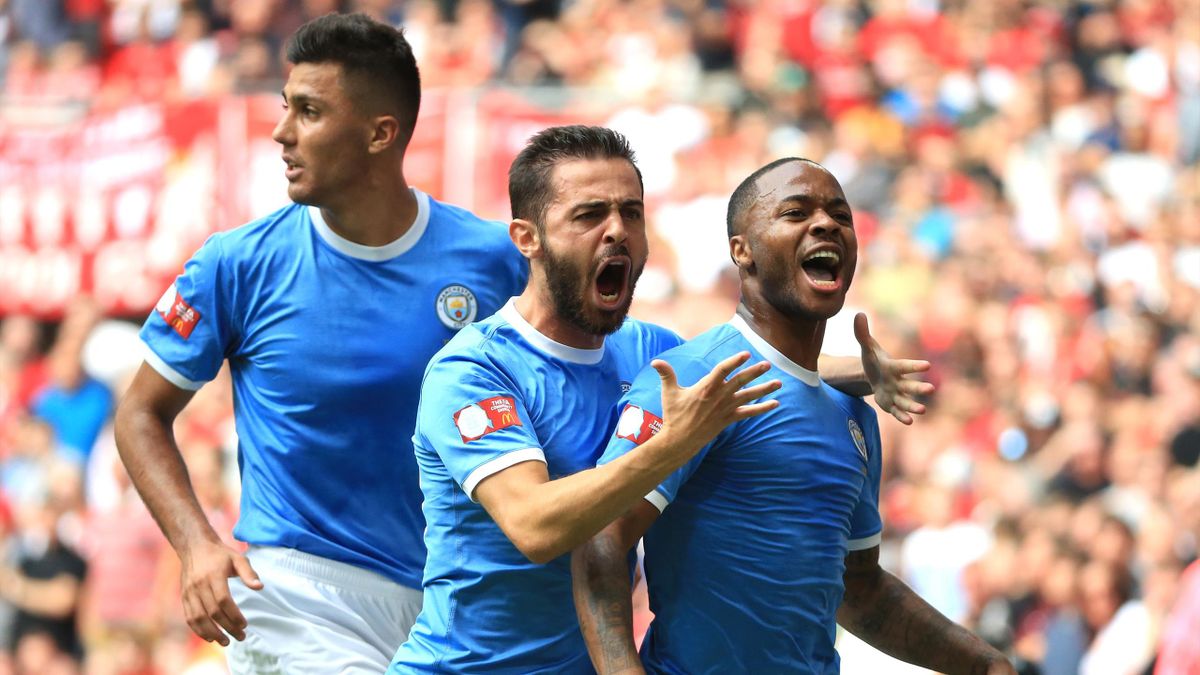 Raheem Sterling of Manchester City celebrates with teammates after scoring his team's first goal during the FA Community Shield match between Liverpool and Manchester City at Wembley Stadium on August 04, 2019 in London, England