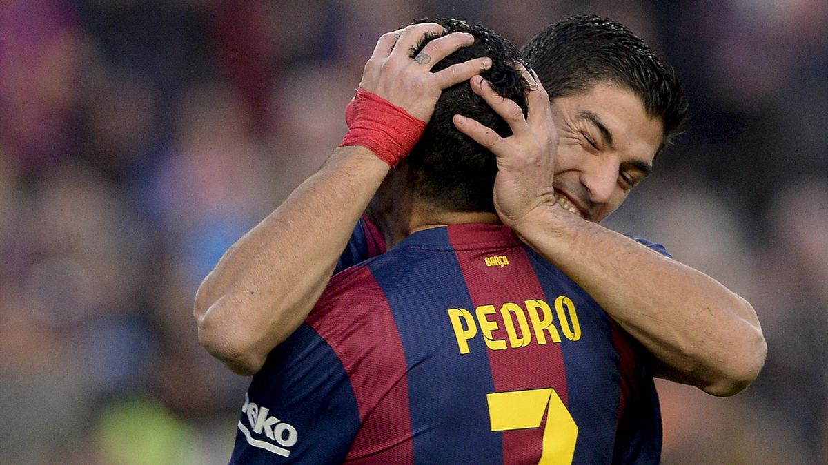 Barcelona's Uruguayan forward Luis Suarez (R) celebrates with Barcelona's forward Pedro Rodriguez after scoring during the Spanish league football match FC Barcelona vs Cordoba CF at the Camp Nou stadium in Barcelona on December 20, 2014