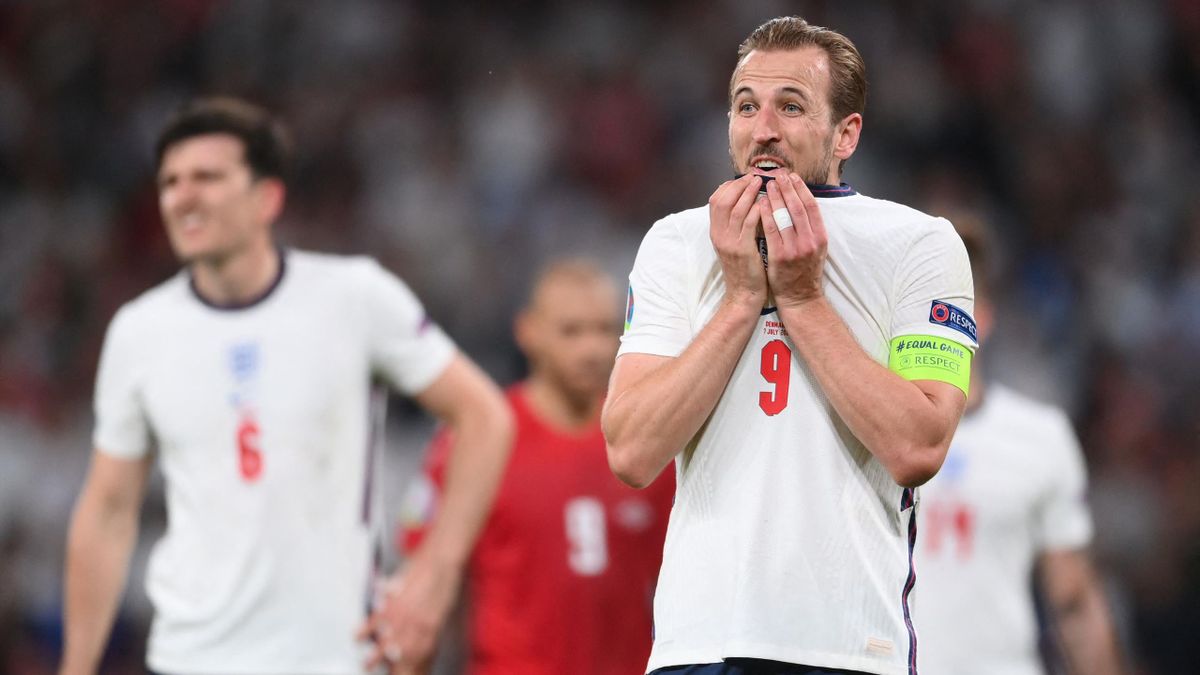 England's forward Harry Kane (R) reacts during the UEFA EURO 2020 semi-final football match between England and Denmark at Wembley Stadium in London on July 7, 2021