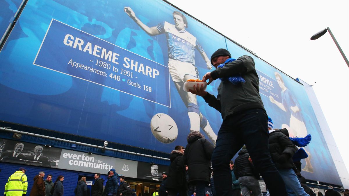 Fans walk outside the stadium prior to the Premier League match between Everton FC and AFC Bournemouth at Goodison Park on January 13, 2019 in Liverpool, United Kingdom