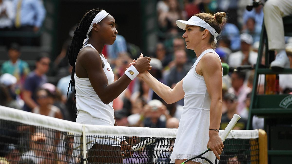 Simona Halep of Romania and Cori Gauff of the United States shake hands at the net following their Ladies' Singles fourth round match against Cori Gauff of the United States during Day Seven of The Championships - Wimbledon 2019