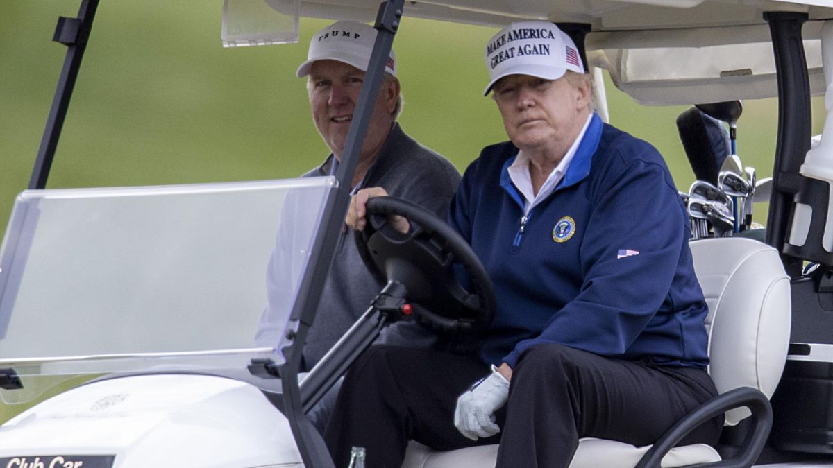 President Donald Trump (R) golfs at Trump National Golf Club on November 22, 2020 in Sterling, Virginia. The previous day Preisdent Donald Trump left a G20 summit virtual event “Pandemic Preparedness” to visit one of his golf clubs as virus has now killed