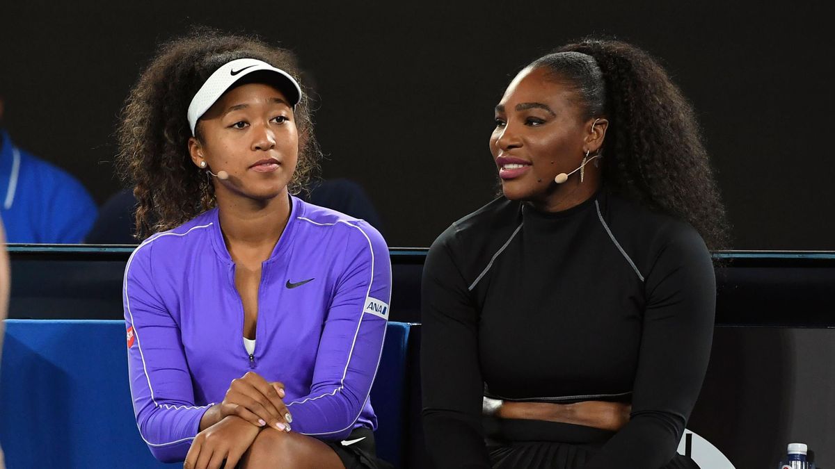 Naomi Osaka of Japan (L) and Serena Williams of the US (R) share a lighter moment as they and other top players play in the Rally for Relief charity tennis match in support of the victims of the Australian bushfires, in Melbourne of January 15, 2020
