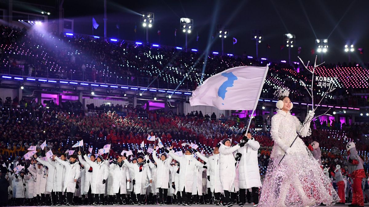 The North Korea and South Korea Olympic teams enter together under the Korean Unification Flag