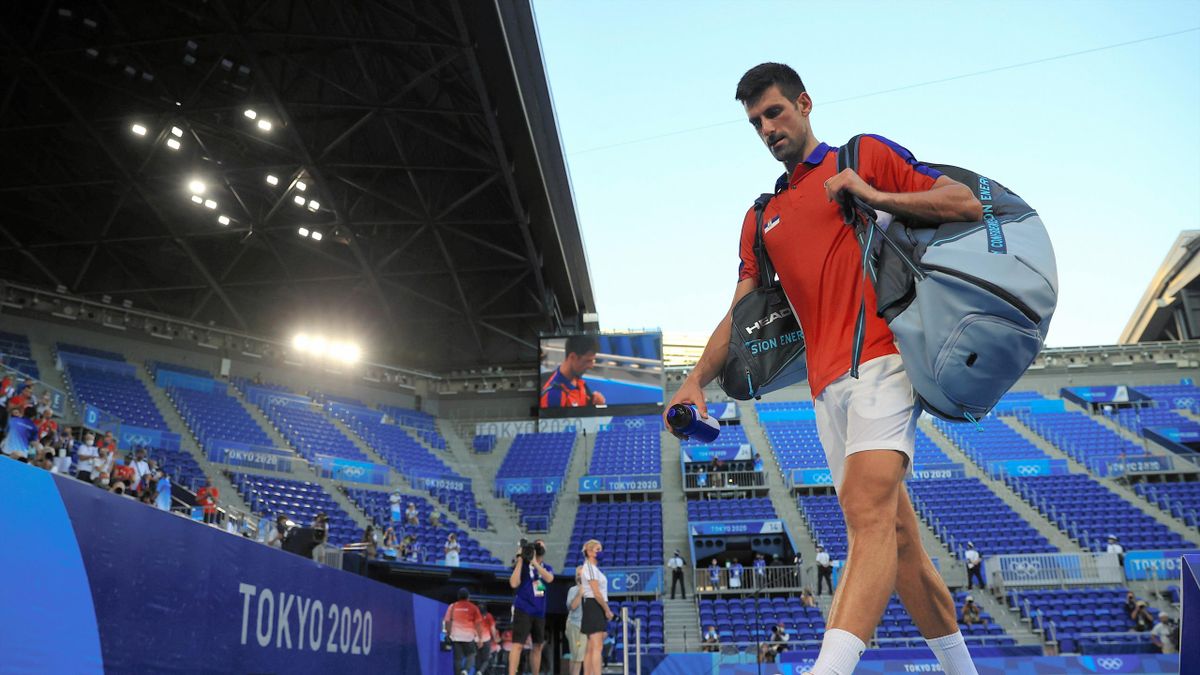 TOKYO, JAPAN - JULY 31: Novak Djokovic of Team Serbia leaves the court after his defeat by Pablo Carreno Busta of Team Spain in the Men's Singles bronze medal match on day eight of the Tokyo 2020 Olympic Games at Ariake Tennis Park on July 31, 2021 in Tok