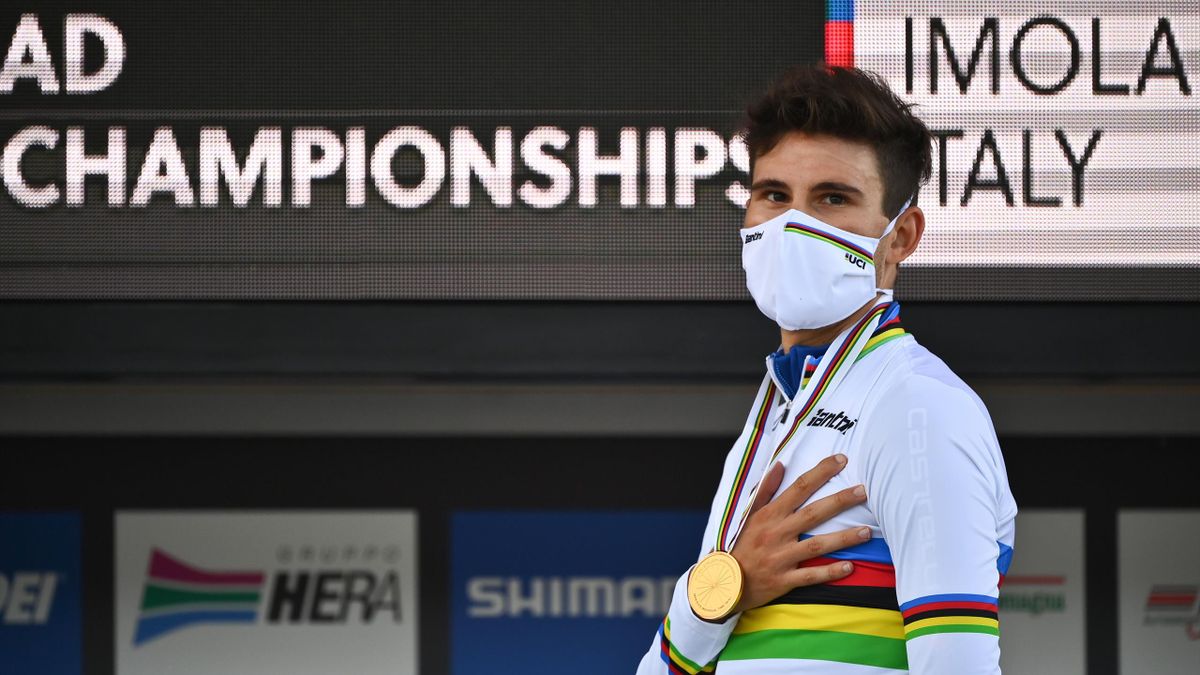 Italy's Filippo Ganna listens to the Italian national anthem on the podium after winning the Men's Elite Individual Time Trial at the UCI 2020 Road World Championships in Imola, Emilia-Romagna, Italy, on September 25, 2020
