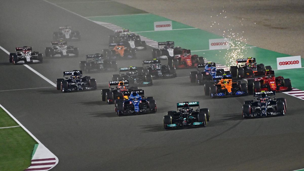 British driver Lewis Hamilton (front-C) leads the pack at the start of the Qatari Formula One Grand Prix at the Losail International Circuit, on the outskirts of the capital city of Doha, on November 21, 2021