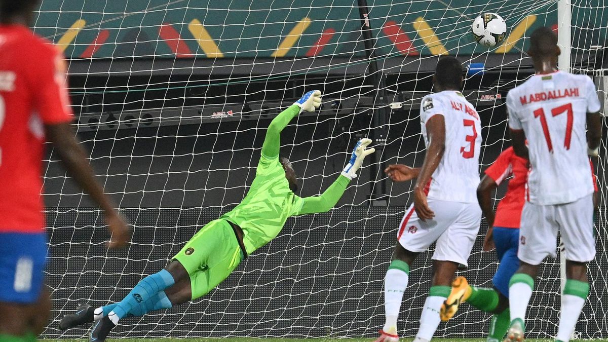 Mauritania's goalkeeper Babacar Diop fails to save a goal shot by Gambia's midfielder Ablie Jallow