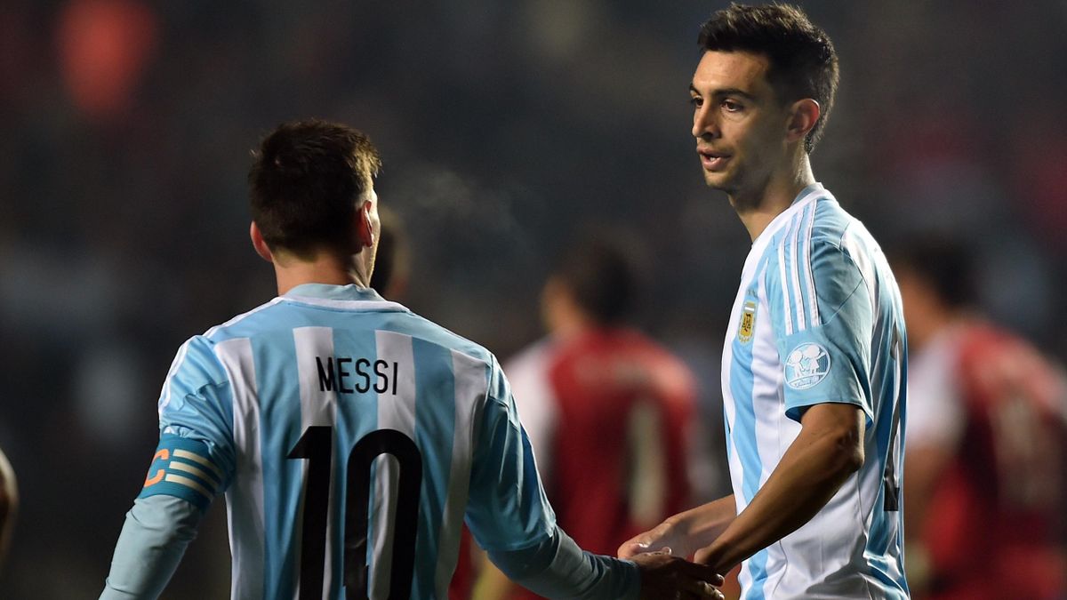 Argentina's midfielder Javier Pastore (R) celebrates with teammate Lionel Messi after scoring against Paraguay during their Copa America semifinal football match in Concepcion, Chile on June 30, 2015. AFP PHOTO / YURI CORTEZ
