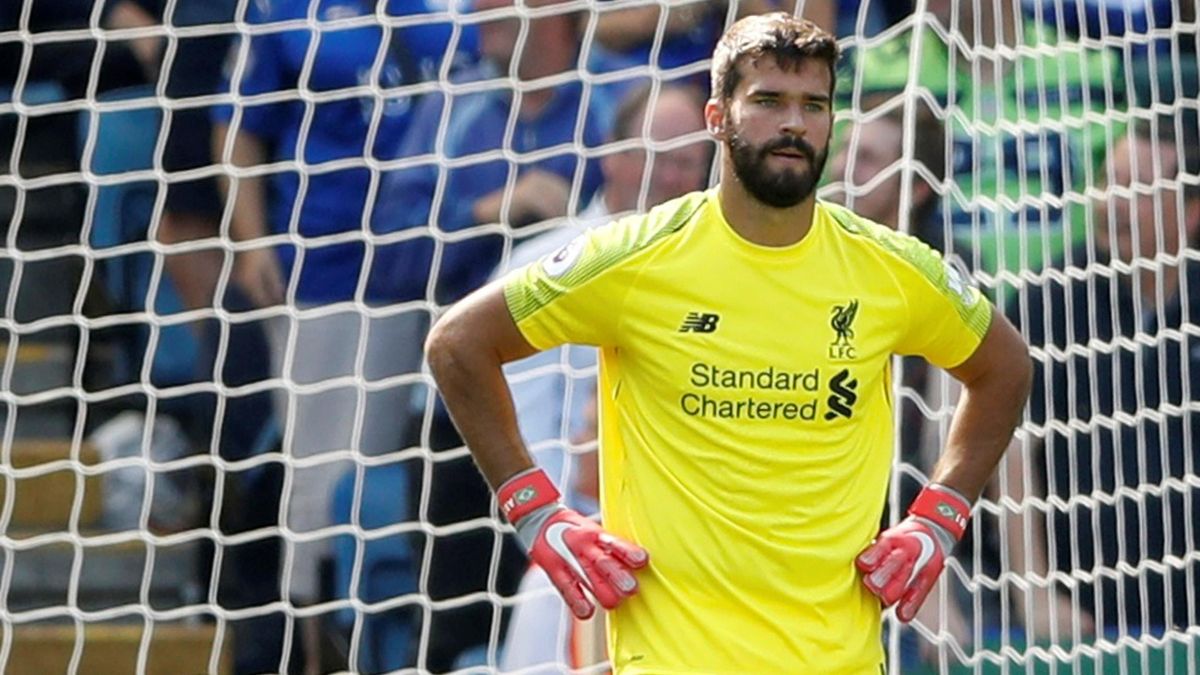 Liverpool's Alisson looks dejected after Leicester City's first goal