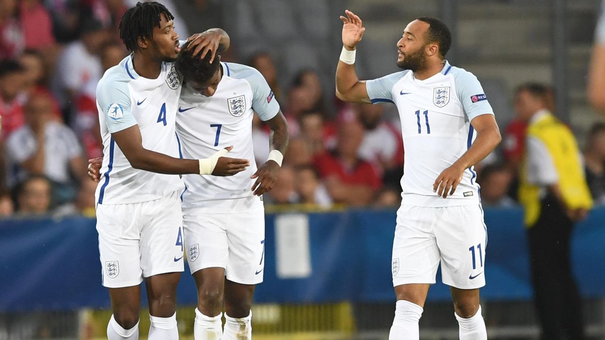 England's midfielder Demaray Grey (C) celebrate scoring the opening goal with his teamate Nathaniel Chalobach (L) and Nathan Redmond during the UEFA U-21 European Championship Group A football match England v Poland in Kielce, Poland on June 22, 2017