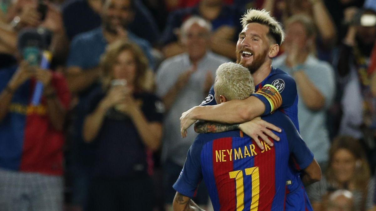 Barcelona's Lionel Messi celebrates scoring their second goal with Neymar