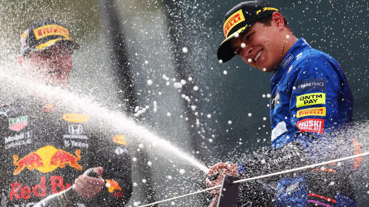 Third placed Lando Norris of Great Britain and McLaren F1 celebrates on the podium during the F1 Grand Prix of Austria