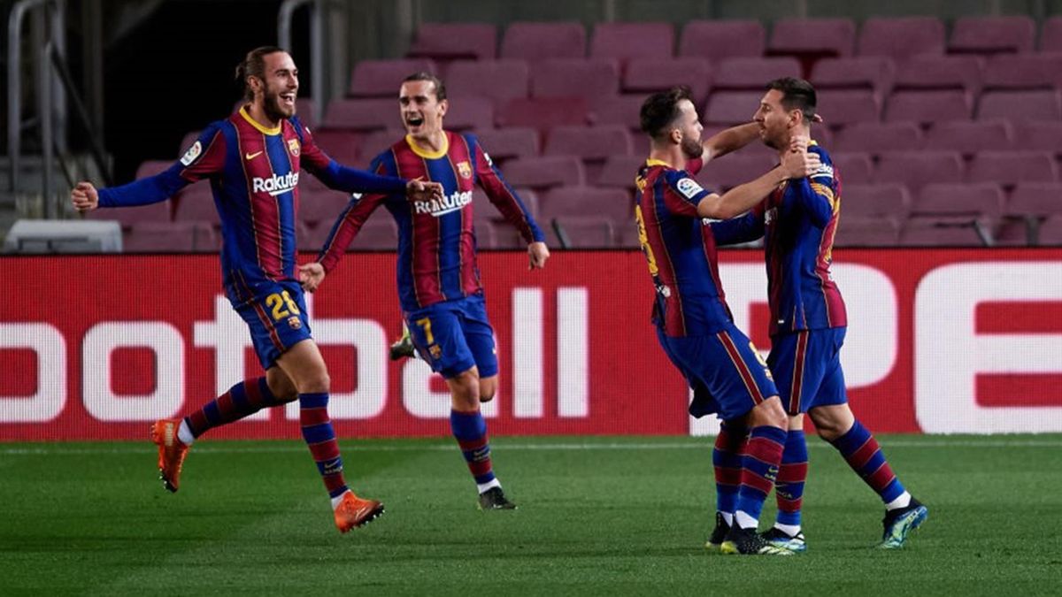Lionel Messi celebrates with Miralem Pjanic, Oscar Mingueza and Antoine Griezmann after scoring the opening goal during the La Liga Santander match between FC Barcelona and Athletic Club at Camp Nou on January 31, 2021 in Barcelona, Spain. Sporting stadiu