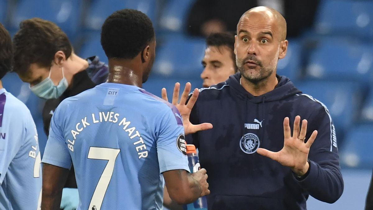 Pep Guardiola speaks to Raheem Sterling during Manchester City's win over Arsenal.