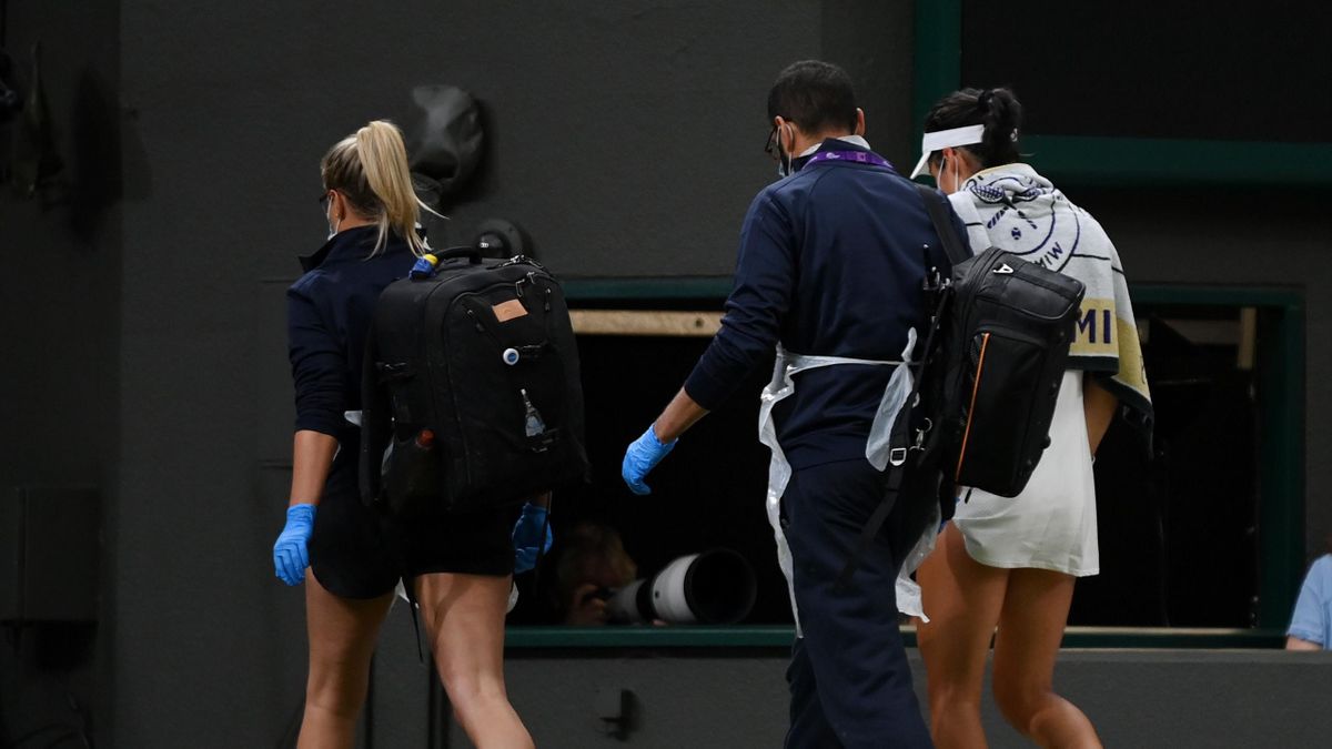Emma Raducanu of Great Britain goes off court for a medical time out in her Ladies' Singles Fourth Round match against Ajla Tomljanovic of Australia during Day Seven of The Championships - Wimbledon 2021