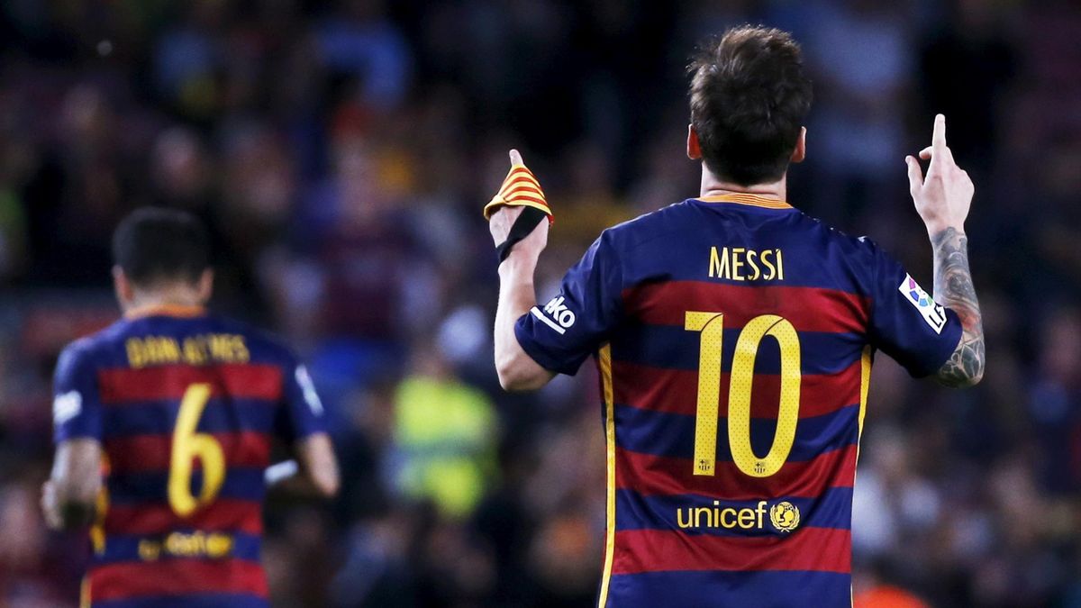 Barcelona's Lionel Messi (10) celebrates his goal against Levante past Levante's Angel Trujillo