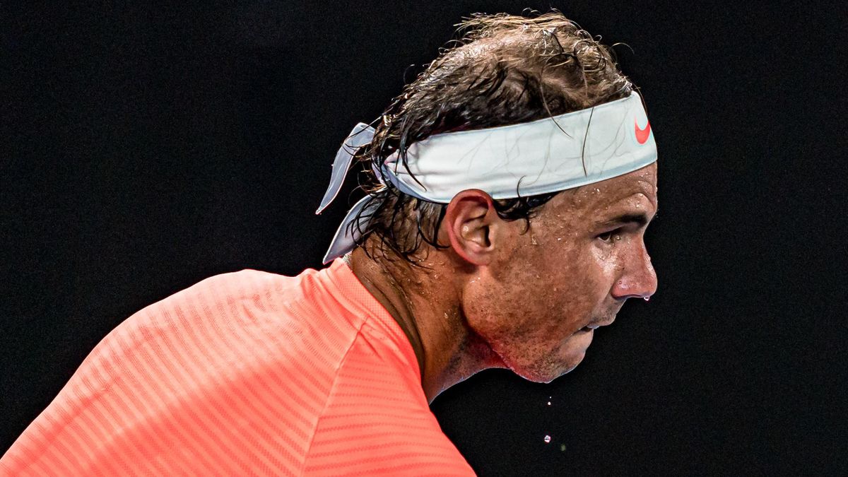 Sweat is seen dripping from Rafael Nadal of Spain during his Men’s Singles Quarterfinals match against Stefanos Tsitsipas of Greece during day 10 of the 2021 Australian Open at Melbourne Park on February 17, 2021 in Melbourne, Australia