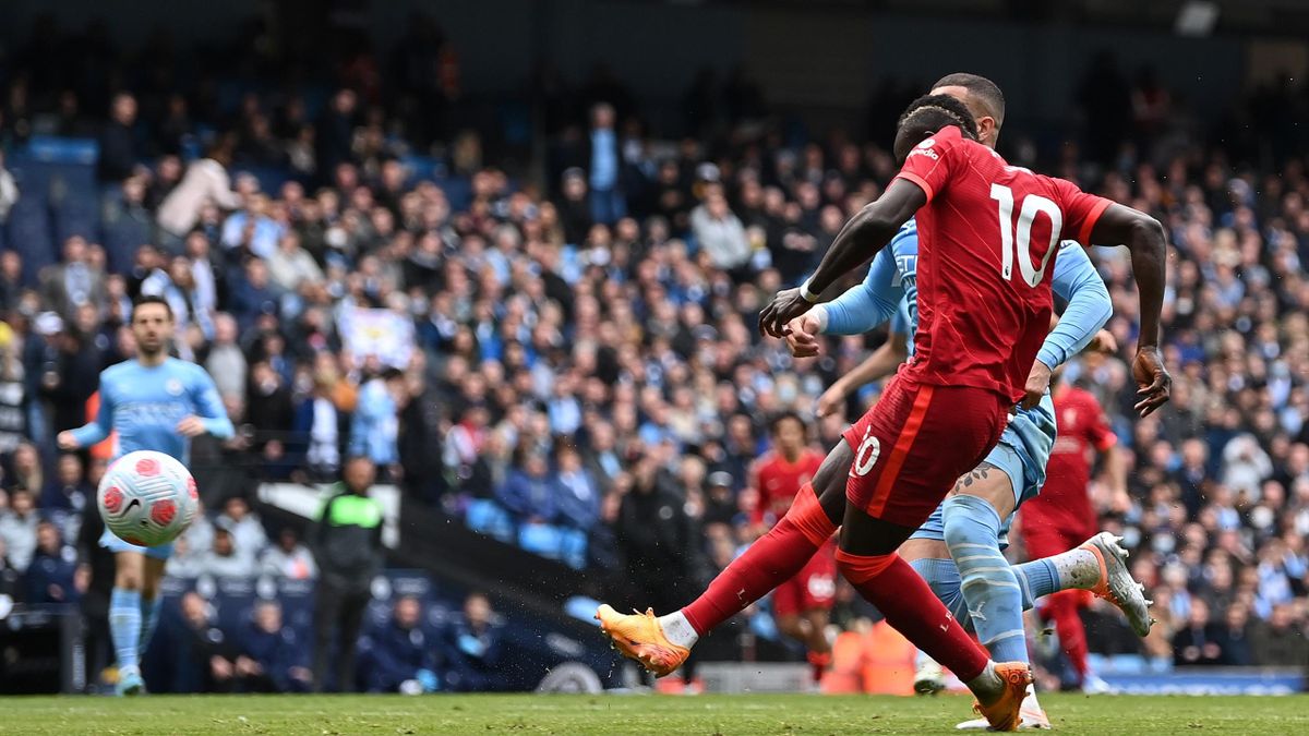 MANCHESTER, ENGLAND - APRIL 10: Sadio Mane of Liverpool scores their sides second goal during the Premier League match between Manchester City and Liverpool at Etihad Stadium on April 10, 2022 in Manchester, England. (Photo by Shaun Botterill/Getty Images