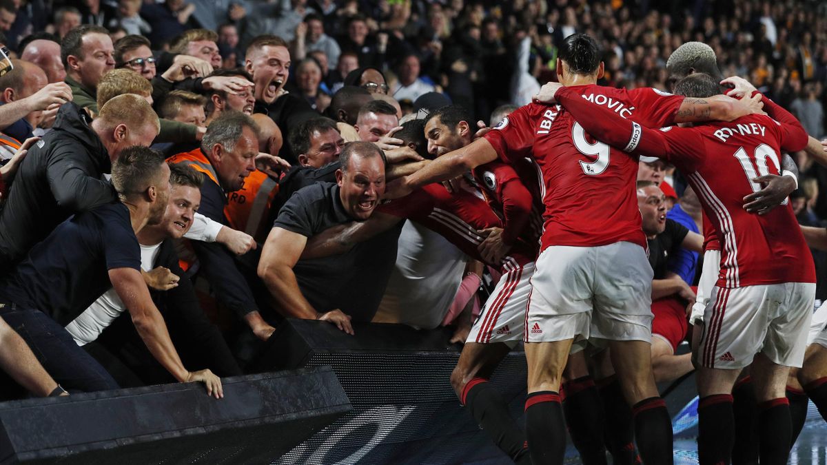 Manchester United's Marcus Rashford celebrates scoring their first goal with fans