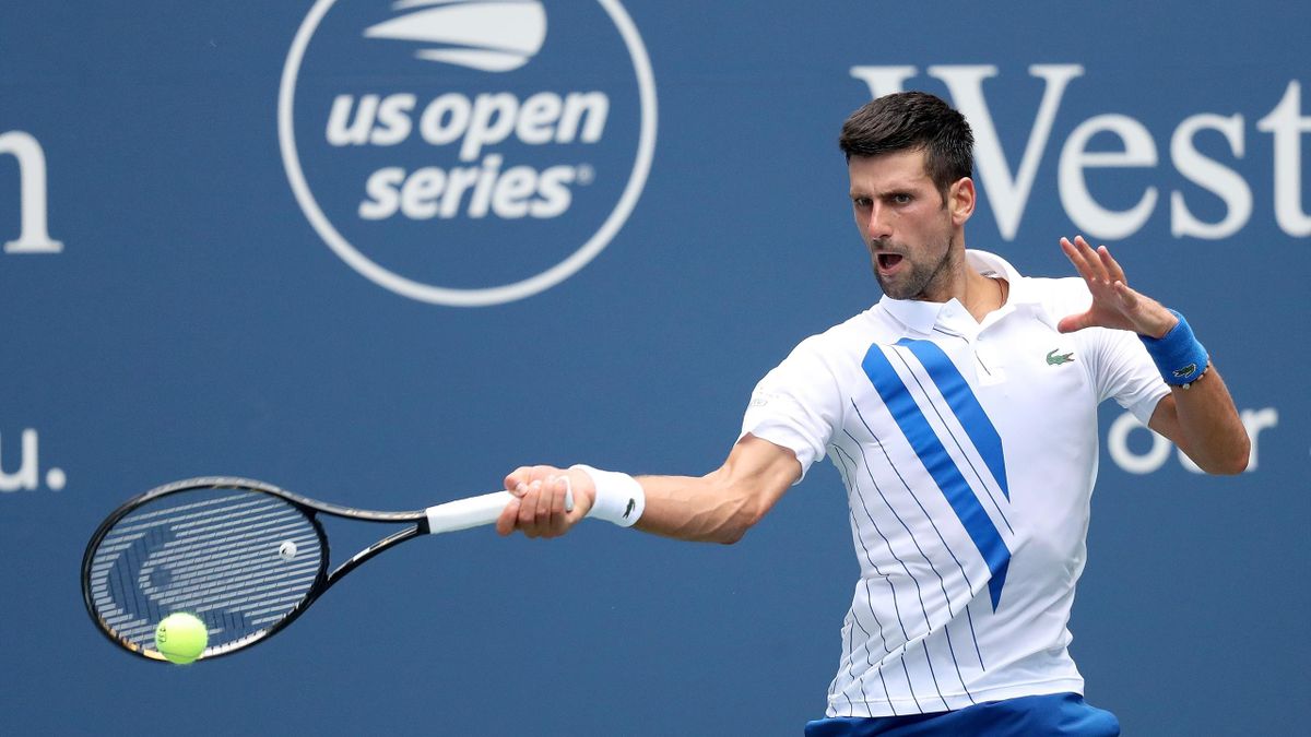 Novak Djokovic of Serbia returns a shot to Roberto Bautista Agut of Spain in their semifinal match during the Western & Southern Open at the USTA Billie Jean King National Tennis Center on August 28, 2020 in the Queens borough of New York City