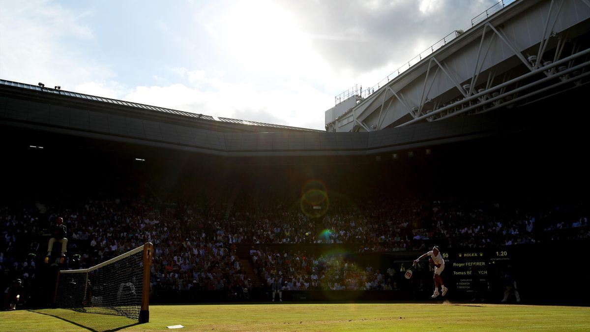 A general view of of centre court as Roger Federer of Switzerland serves during the Gentlemen's Singles semi final match against Tomas Berdych of The Czech Republic