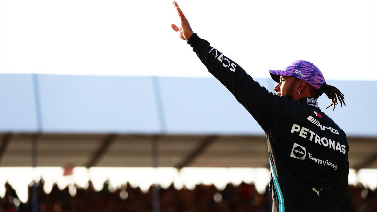 Fastest qualifier Lewis Hamilton of Great Britain and Mercedes GP celebrates in parc ferme during qualifying ahead of the F1 Grand Prix of Great Britain at Silverstone